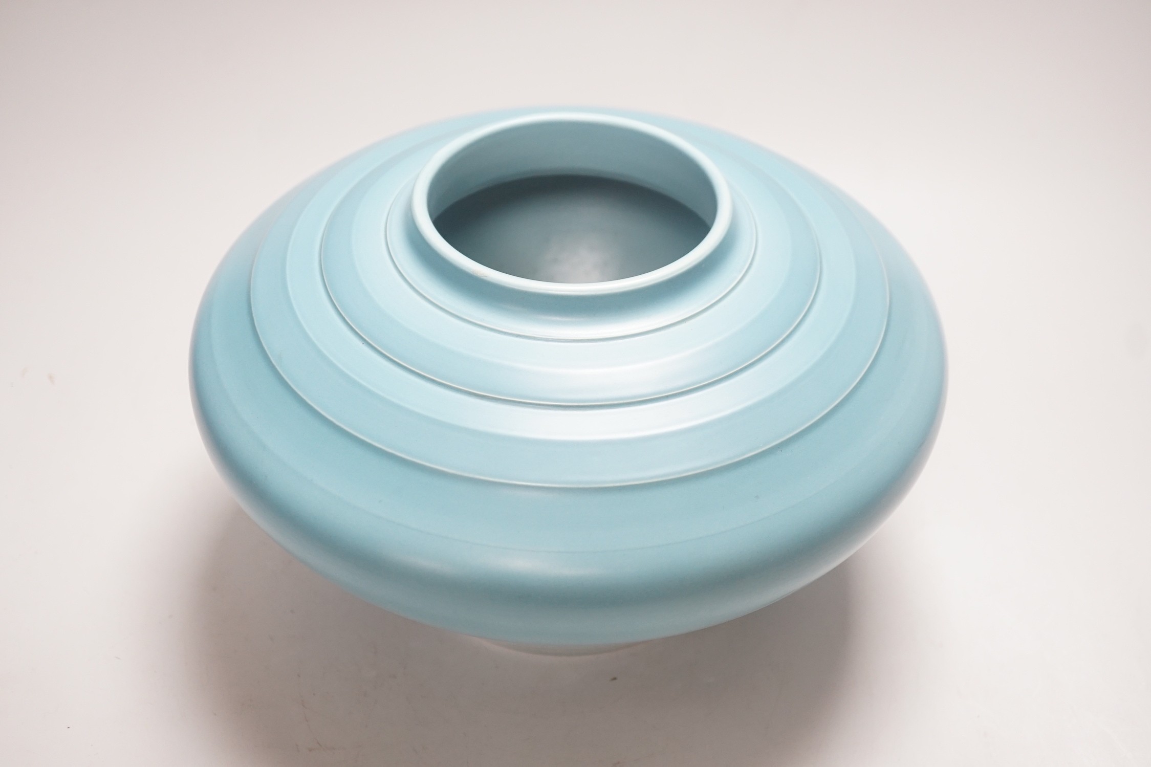 Keith Murray for Wedgwood, a squat vase in blue monochrome glaze, 26cm diameter, 16cm tall